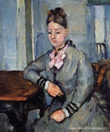 Madame Cezanne leunt op een tafel