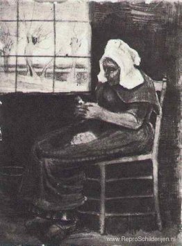 Vrouw schilt aardappelen bij een raam Vrouw schilt aardappelen bij een raam