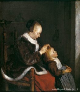 Moeder kamt het haar van haar kind Moeder kamt het haar van haar kind