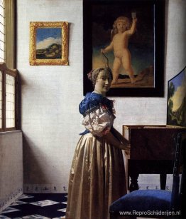 Een dame die bij een virginaal staat Een dame die bij een virginaal staat