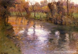Een boomgaard aan de oevers van een rivier Een boomgaard aan de oevers van een rivier