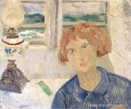 Meisje en lamp in een raam in Cornwall Meisje en lamp in een raam in Cornwall