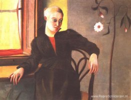 Vrouw zit bij het raam Vrouw zit bij het raam