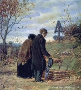Oude ouders bezoeken het graf van hun zoon Oude ouders bezoeken het graf van hun zoon